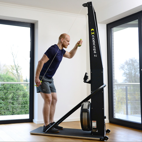 Concept2 SkiErg with PM5 in home, man using the machine