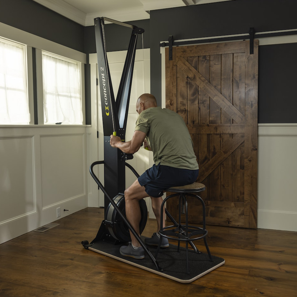 Concept2 SkiErg with PM5 in home, man using whilst seated