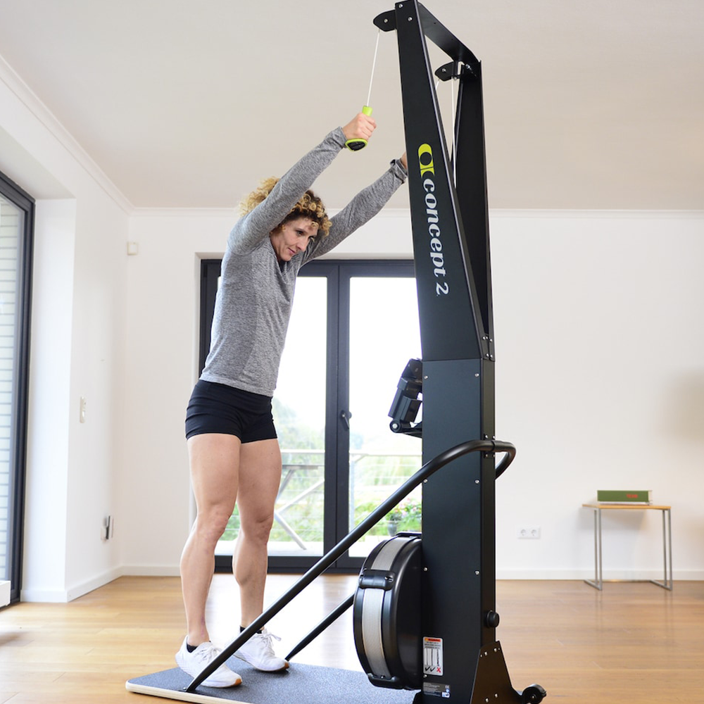 Concept2 SkiErg with PM5 in home, woman using machine