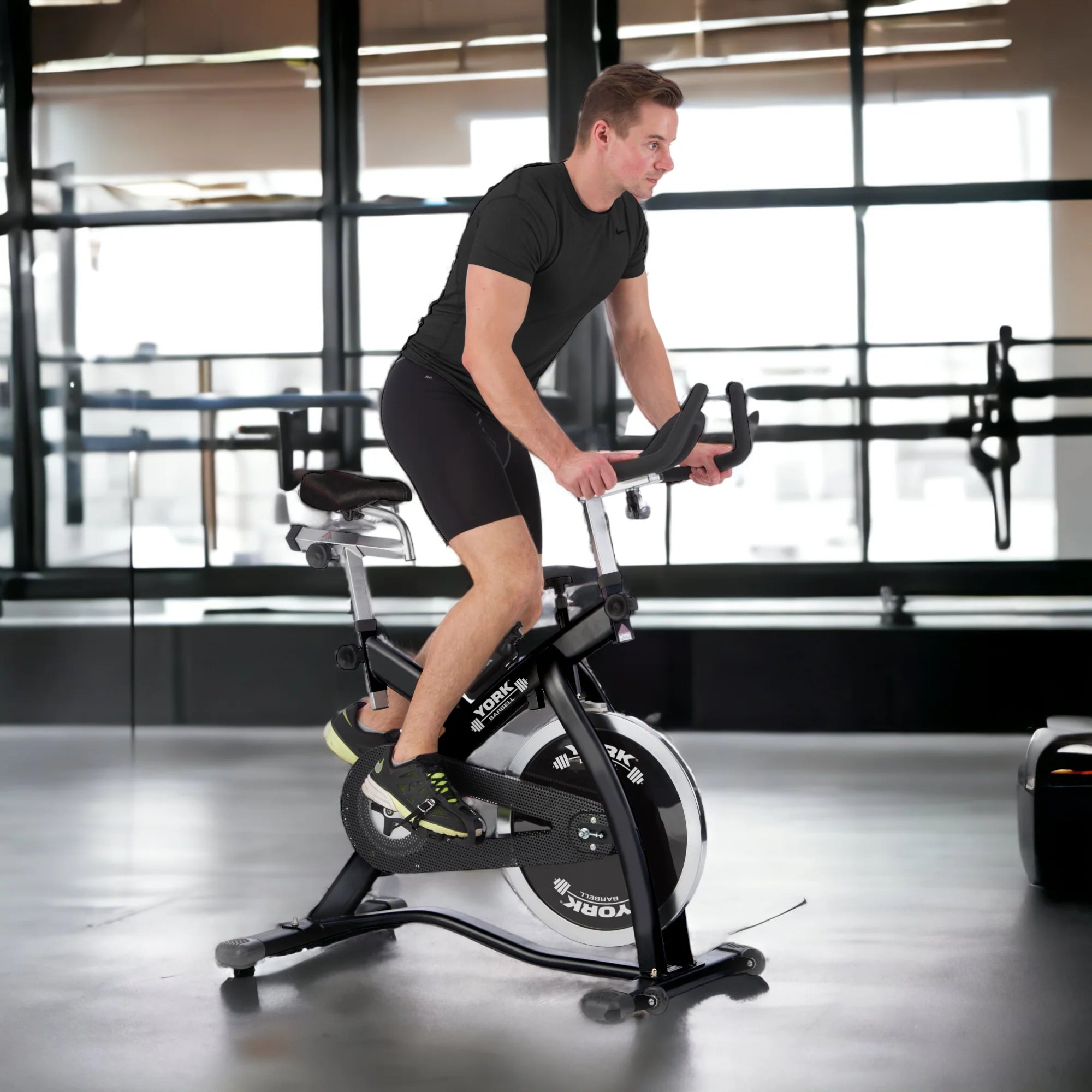 York Barbell Indoor Training Bike CSB32, man using the bike